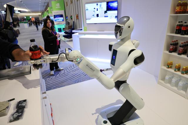 Humanoid robot Galbot serves ordered cola at CES 2025 Las Vegas Convention Center Yonhap