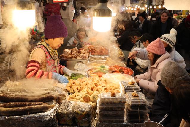 Food stalls in Gwangjang Markets food alley AJP Han Jun-gu