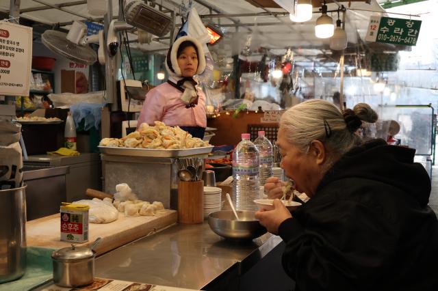 Food stalls in Gwangjang Markets food alley AJP Han Jun-gu