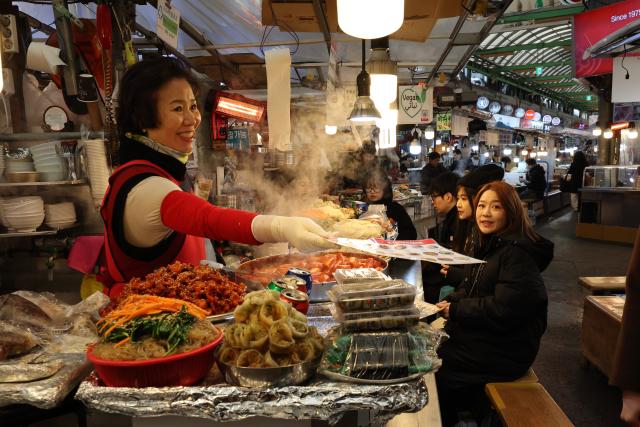 Food stalls in Gwangjang Markets food alley AJP Han Jun-gu