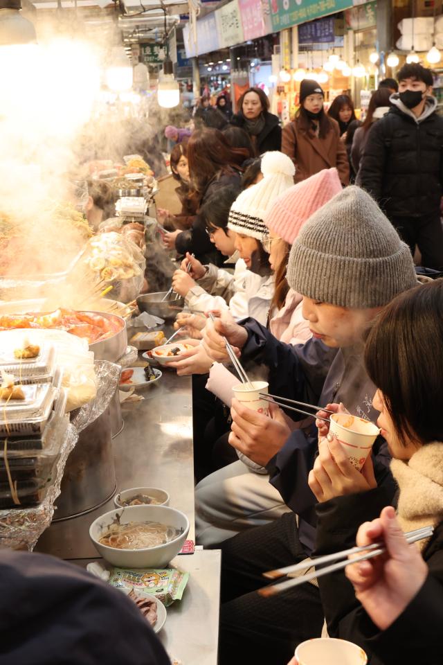 Food stalls in Gwangjang Markets food alley AJP Han Jun-gu