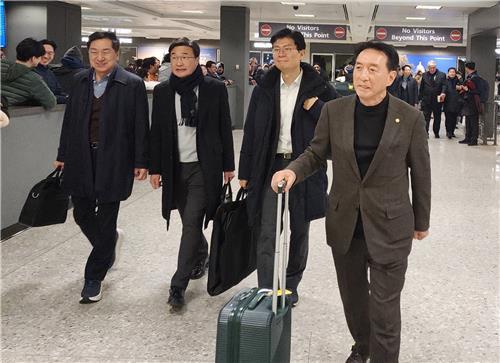 South Korean lawmakers including Kim Seok-ki first from the right Chairman of the National Assemblys Foreign Affairs and Unification Committee arrive in the US through Dulles International Airport near Washington DC on the 18th ahead of President-elect Donald Trumps inauguration on the 20th local time