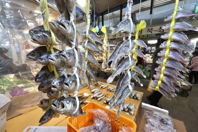 Dried yellow corvina hangs at a store in Kyungdong Market AJP Han Jun-gu