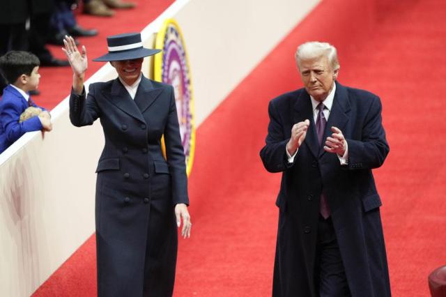 President Donald Trump and first lady Melania Trump arrive at an indoor Presidential Inauguration parade event in Washington on Jan 20 2025 AP-Yonhap