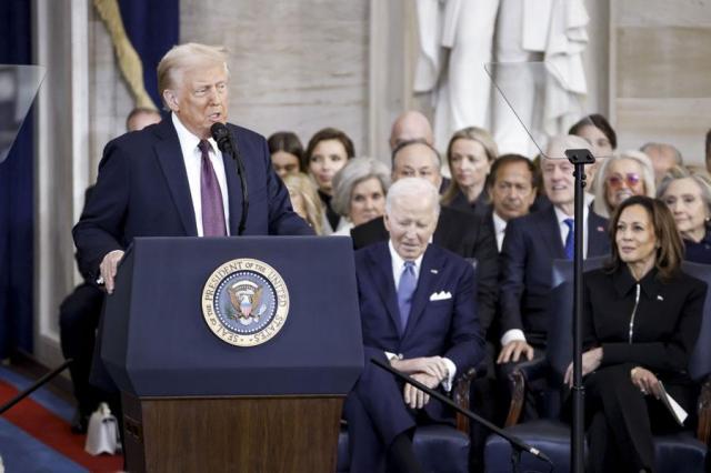 President Donald Trump delivers remarks after being sworn in as the 47th US President during the 60th Presidential Inauguration in the Rotunda of the US Capitol in Washington on Jan 20 2025 as former President Joe Biden and former Vice President Kamala Harris look on AP-Yonhap