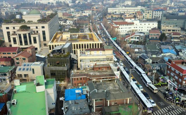 A police barricade is set up with police buses on the roads around the Constitutional Court in Jongno-gu Seoul on Tuesday Yonhap