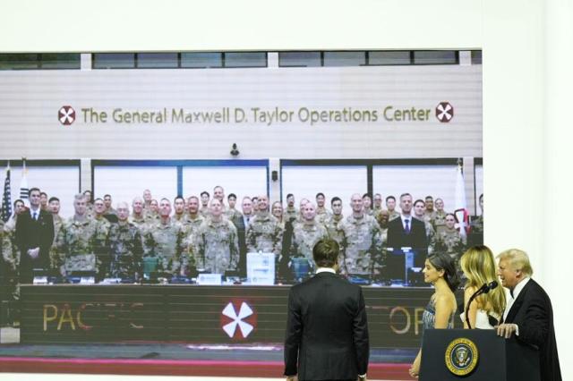 President Donald Trump first lady Melania Trump Usha Vance and Vice President JD Vance speak on screen with members of the military at the Commander in Chief Ball in Washington on Jan 20 2025 AP-Yonhap