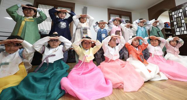 Ahead of Seollal kindergarten children in Daegu learn the customs of sebae New Years bow on Thursday Yonhap