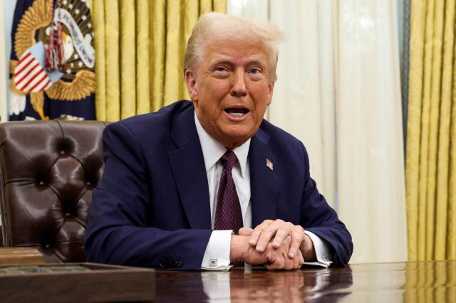 US President Donald Trump sits in the Oval Office of the White House Jan 23 2025 Reuters-Yonhap