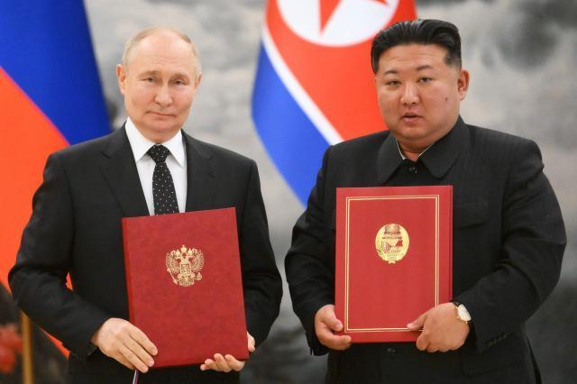 Russian President Vladimir Putin left signs the comprehensive strategic partnership with North Korean leader Kim Jong-un in Pyongyang on June 19 2024 AFP-Yonhap