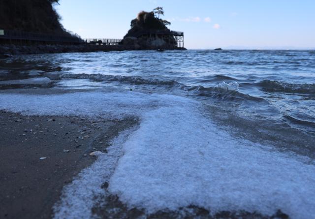 At Dadaepo Beach in Busan seawater that had surged in during high tide froze under the extreme cold 