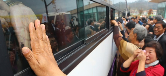 Separated families say their final goodbyes after a reunion event at the the Kumgang reunion center in this file photo taken on Oct. 22, 2015.