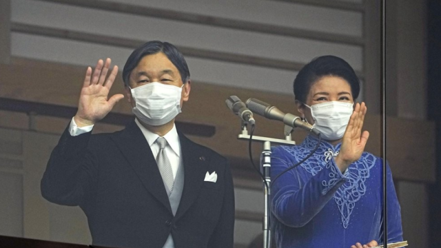 Japanese Emperor Naruhito and Empress Masako wave from the balcony of the Imperial Palace in Tokyo during his birthday celebration in this file photo taken on Feb 23 2023 Yonhap