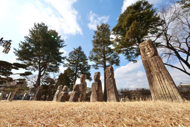 Dongja-seok young boy statues Beoksu guardian posts and Muninseok civil official statues at the National Folk Museum of Korea AJP Han Jun-gu