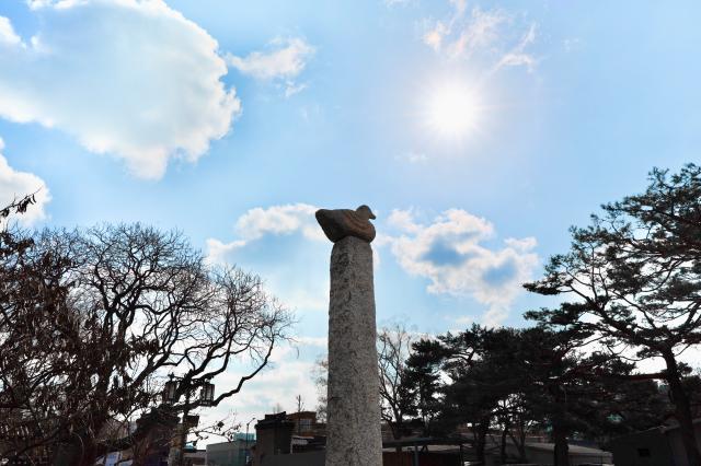 Sotdae Korean traditional wooden pole with a carved bird on top at the National Folk Museum of Korea AJP Han Jun-gu