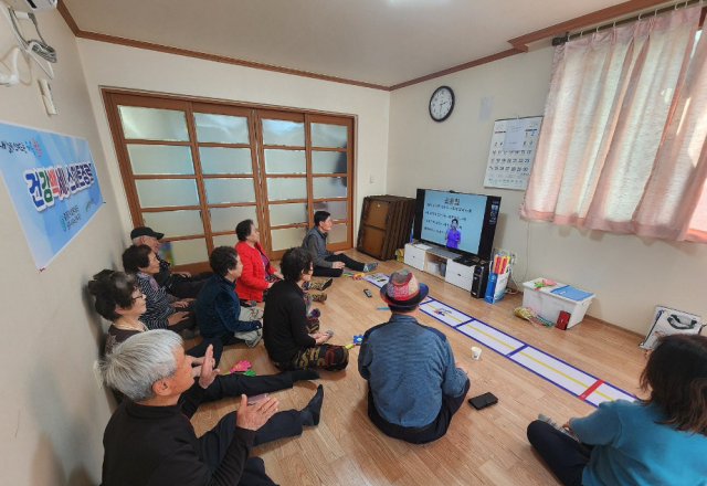 Elderly people watch TV at a senior center in Ulsan South Korea on Mar 13 2025 Yonhap