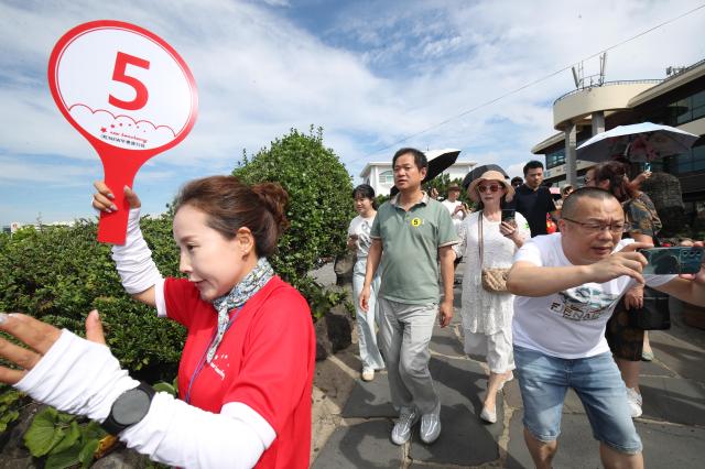 韩国拟推中国团体游客免签 济州旅游业"喜忧参半"