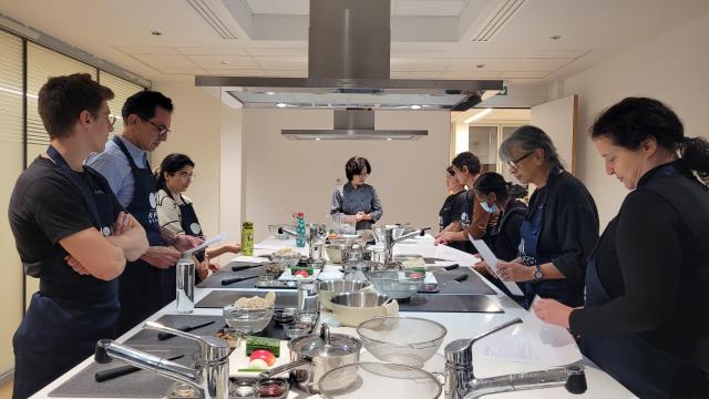 Participants learn to cook Korean dishes during a culinary course hosted by the Korean Cultural Center in France in this file photo taken in November 2024 Courtesy of the Korean Cultural Center in France