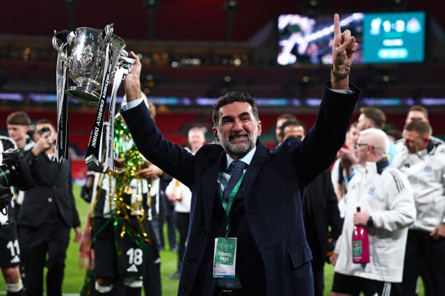 Saudi Aramco and Newcastle Uniteds Chairman Yasir O Al-Rumayyan celebrates with the trophy after the English League Cup final football match between Liverpool and Newcastle United at Wembley Stadium north-west London March 16 2025 AFP-Yonhap