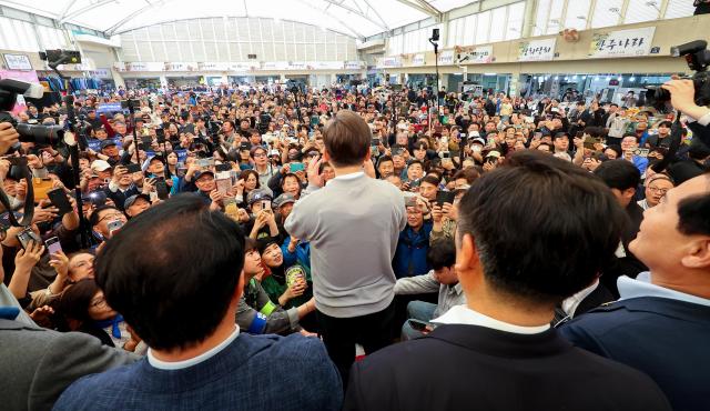 Democratic Party presidential candidate Lee Jae-myung delivers a speech at Gamdong Market in Gangjin South Jeolla Province May 11 2025 Yonhap