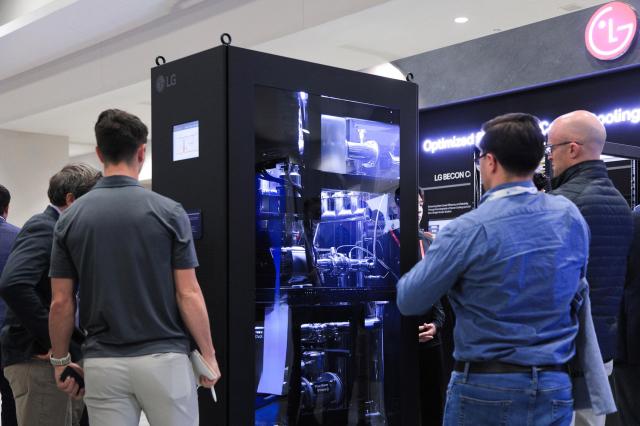 Visitors inspect LG Electronics coolant distribution units for data centers at the Data Center World 2025 convention in Washington April 17 2025 Courtesy of LG Electronics