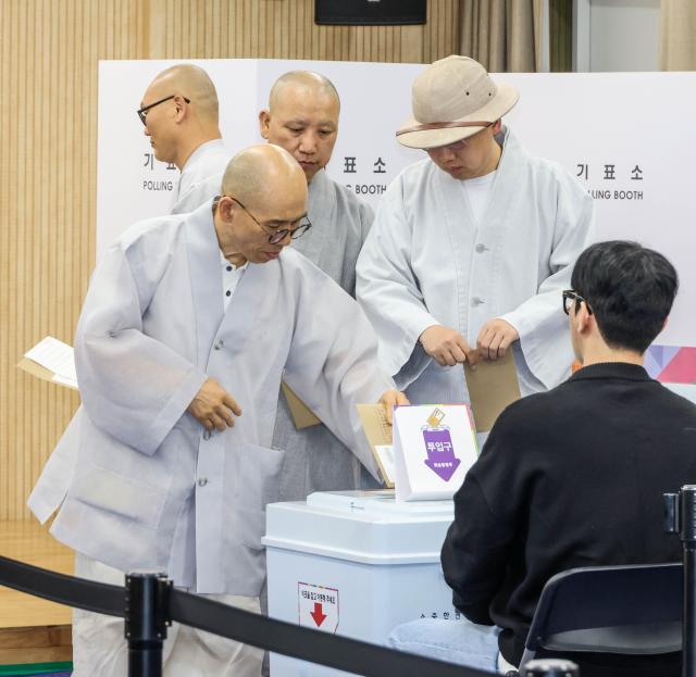 Monks from Jogyesa Temple vote at an early voting station in Jongno Seoul on May 29 2025 Yonhap