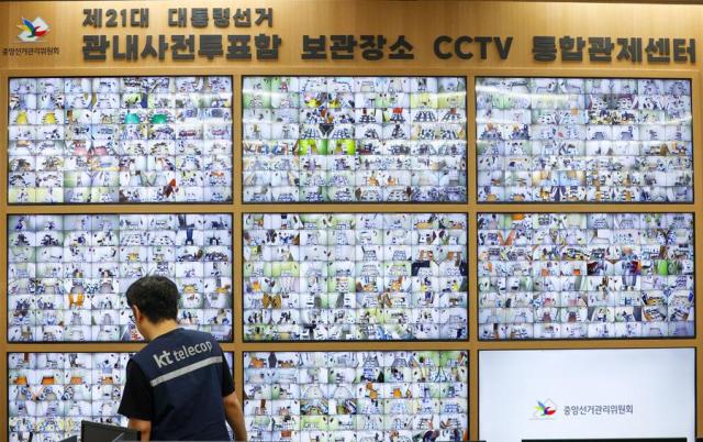 An official checks ballot boxes through surveillance cameras at the National Election Commission in Gwacheon Gyeonggi Province on June 2 2025 Yonhap