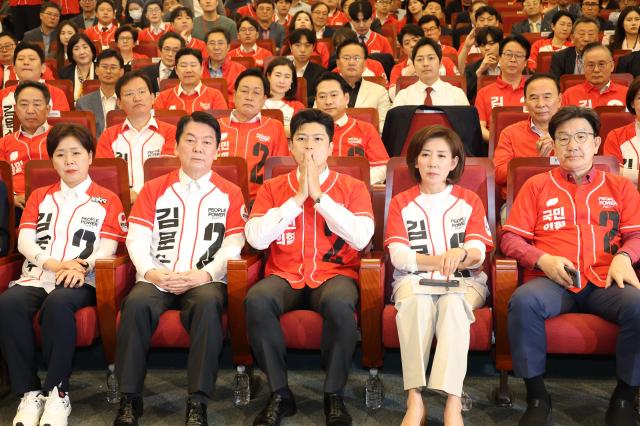 Senior and joint election campaign chiefs of the People Power Party stare in disbelief as exit poll results are announced at the vote monitoring room for the 21st presidential election set up at the National Assembly Library in Seoul on Jun 3 National Assembly Joint Press Corps