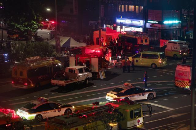 Police investigate the scene of a deadly crash near Seoul City Hall on July 1 2024 where a car driven by a 68-year-old man fatally struck nine pedestrians YONHAP