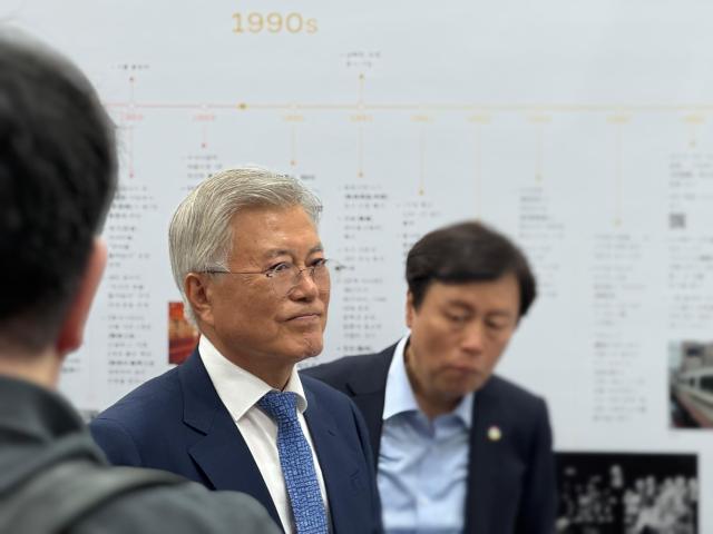 Former President Moon Jae-in looks around the Taiwanese booth at the Seoul International Book Fair at COEX in southern Seoul on June 18 2025