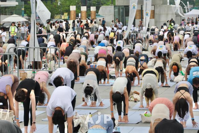 Participants practice yoga during the 11th International Day of Yoga event held at Gwanghwamun Square in central Seoul on June 21 2025 AJP Han Jun-gu