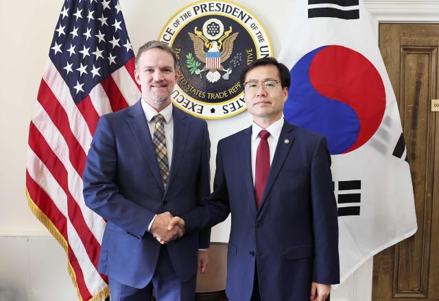 South Koreas Minister of Trade Industry and Energy Yeo Han-koo right poses for a photo prior to his meeting with USTR chief Jamison Greer in Washington DC on July 25 local time Courtesy of the Ministry of Trade Industry and Energy