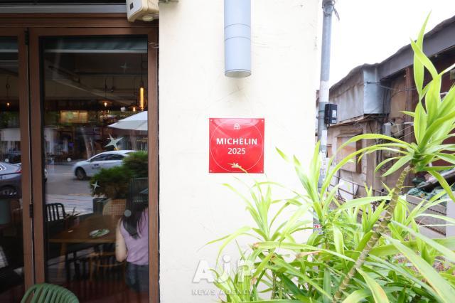 A sign displaying Michelin selection in front of vegan restaurant ALTa Aug 11 2025 AJP Han Jun-gu