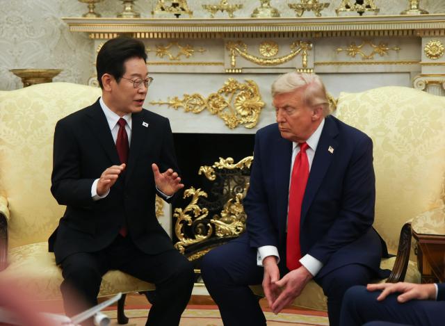 PHOTOS: President Lees first summit with Trump