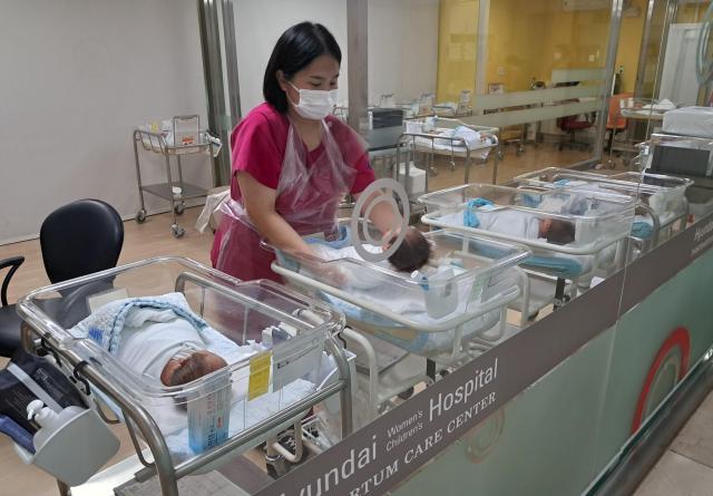 A nurse tending newborn babies at a public postpartum care center Courtesy of South Jeolla Province