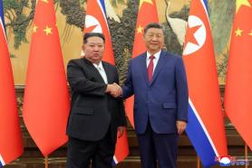 Kim Jong-un and Xi Jinping pledge unshakable ties through summit meeting