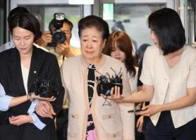 Unification Church leader appears for questioning over bribery allegations