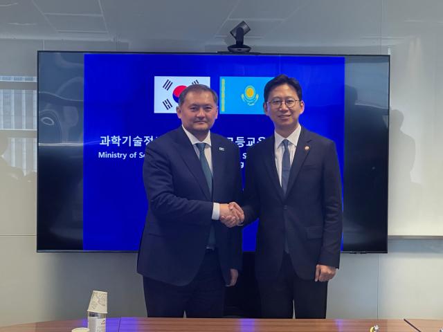 Kazakh Minister of Science and Higher Education Sayasat Nurbek right shakes hands with South Korean Minister of Science and ICT Bae Kyung-hoon left during their meeting in Seoul Courtesy og the Embassy of Kazakhstan in the Republic of Korea 