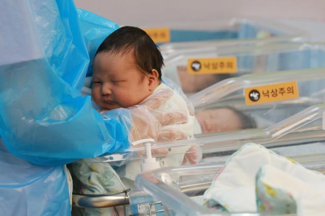 Nurses care for newborns in a neonatal unit at a hospital in Gyeonggi Province on July 24 2025 Yonhap