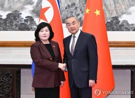 Xis appearance at N. Koreas military parade quietly speculated after foreign ministers meeting