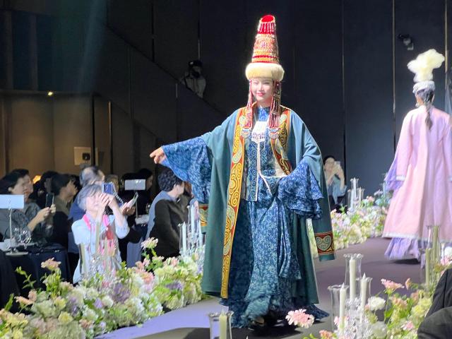 A model wearing a traditional Kazakh costume walks the runway during the Central Asia–Korea Friendship Day fashion show in Seoul Courtesy of the Embassy of Kazakhstan in the Republic of Korea