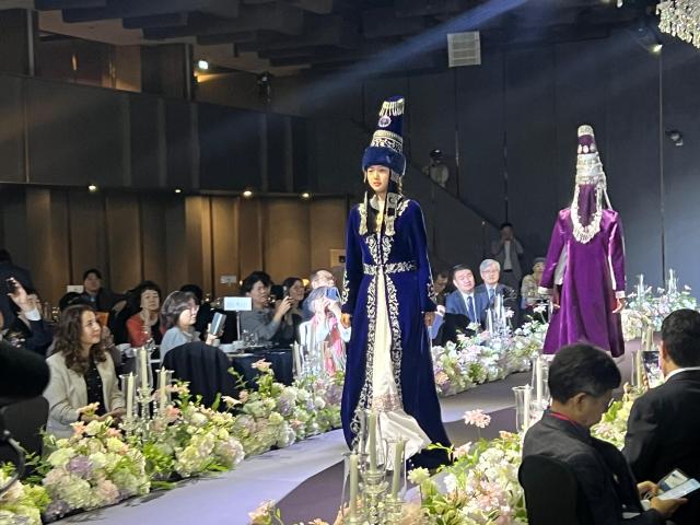 A model wearing a traditional Kazakh costume walks the runway during the Central Asia–Korea Friendship Day fashion show in Seoul Courtesy of the Embassy of Kazakhstan in the Republic of Korea