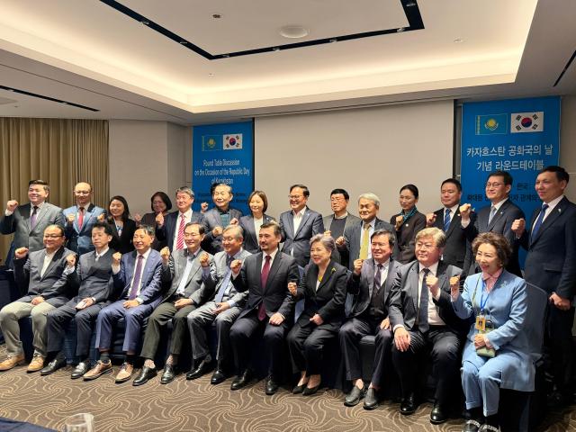 Participants of a roundtable hosted by the Embassy of Kazakhstan gather for a commemorative photo in central Seoul on Oct 21 2025 AJP Im Yoon-seo