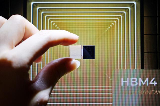 A sixth-generation high-bandwidth memory HBM4 chip is displayed at SK hynix’s booth during the Semiconductor Exhibition SEDEX 2025 at COEX in Seoul on Oct 22 2025 Yonhap