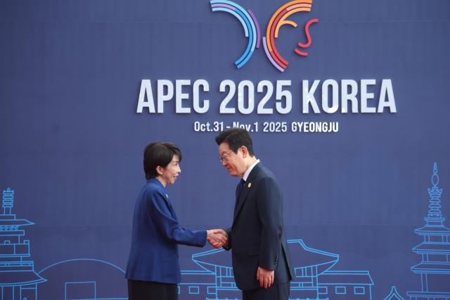 South Korean President Lee Jae Myung greets Japanese Prime Minister Takaichi Sanae during the 2025 Asia-Pacific Economic Cooperation APEC Summit at the HICO Convention Center in Gyeongju on October 31 Joint Press Corps