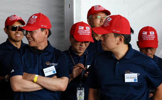 Participants in the naming ceremony of the State of Marine are seen wearing red hats written with the slogan Make American Shipbuilding Great Again Aug 26 2025 Yonhap