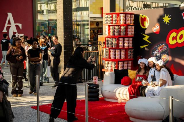 Visitors pose for photos at Samyang Foods’ “Buldak Couch Time” Halloween pop-up store at Westfield Century City in Los Angeles Nov 6 2025 Courtesy of Samyang Foods