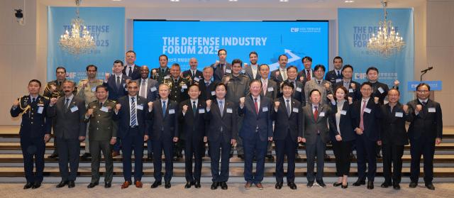 From left in the first row Thailand defense attaché Sorapat Phetchmongkol Iraq defense attaché AQEEL Alkarawi Cambodia defense attaché Choeun Vicheth India defense attaché Ashish Gairola Jeonbuk National University President Yang O-bong Vice Defense Minister Lee Doo-hee Democratic Party lawmaker Hwang Myung-sun Aju Business Daily CEO Lim Kwu-jin National Assembly Deputy Speaker Lee Hack-young People Power Party lawmaker Yoo Yong-won Defense Ministry Force Policy Director Lee Sung-eun DA Advisory managing partner Lee Kyu-chul former Navy Chief of Staff Boo Suk-jong and Director of programing at Defense Acquisition Progra Administration Kim Il-dong posing for a photo ahead of the Defense Industry Forum 2025 held in western Seoul on Nov 20 2025