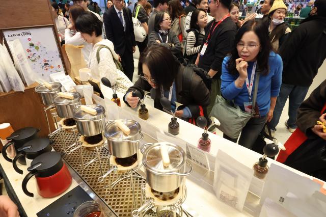 Visitors smell coffee at Cafe Show 2025 held at COEX in southern Seoul Nov 20 2025 AJP Han Jun-gu