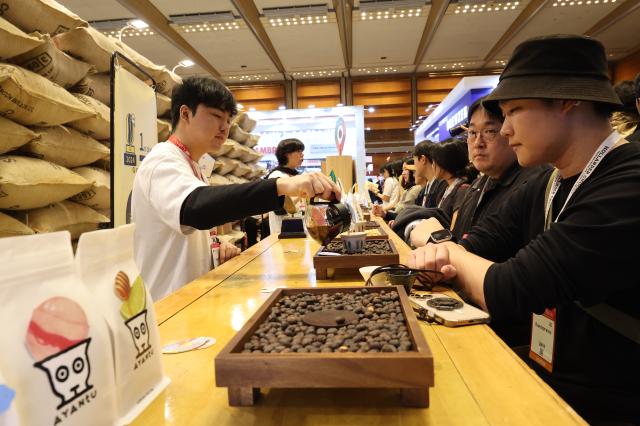 Visitors experience coffee tasting at Cafe Show 2025 held at COEX in southern Seoul Nov 20 2025 AJP Han Jun-gu